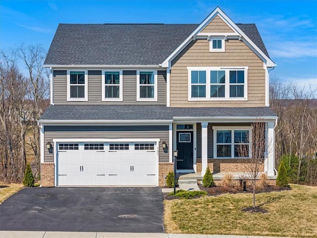127 Red Horse Dr, Buffalo Twp, PA 16055 - craftsman inspired home with brick siding, asphalt driveway, covered porch, and an attached garage