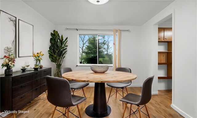4817 E Willock Rd, Baldwin Boro, PA 15227 - dining room with light wood-style flooring and baseboards