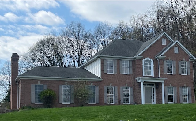 1849 Dutch Ridge Rd, Wayne Twp Law, PA 16117 - colonial inspired home featuring a chimney, a front yard, brick siding, and roof with shingles