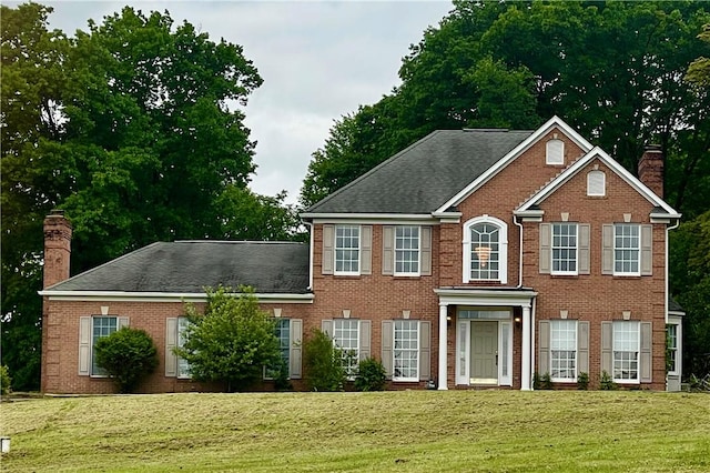1849 Dutch Ridge Rd, Wayne Twp Law, PA 16117 - view of front facade featuring a chimney, brick siding, and a front lawn
