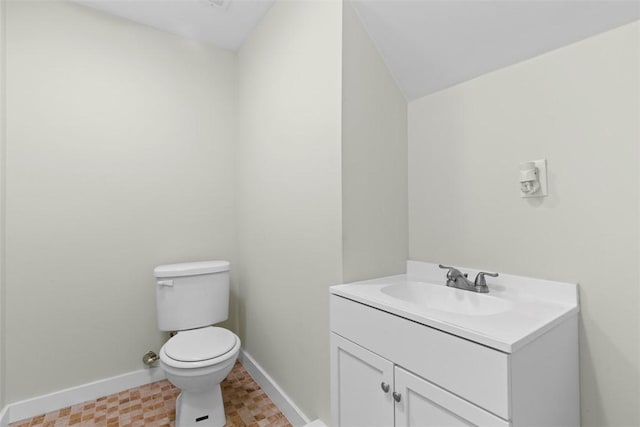 3050 S Park Rd, Bethel Park, PA 15102 - bathroom featuring toilet, vanity, and baseboards
