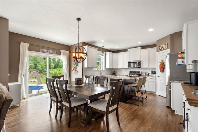 1641 Holly Hill Dr, Bethel Park, PA 15102 - dining room with a chandelier, dark wood-style flooring, and recessed lighting