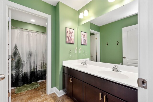 1641 Holly Hill Dr, Bethel Park, PA 15102 - bathroom with double vanity and baseboards