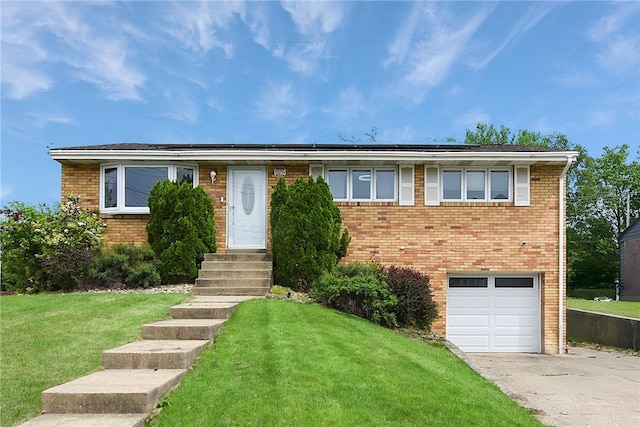 415 Governor Dr, Shaler, PA 15101 - view of front facade featuring brick siding, driveway, a front lawn, an attached garage, and roof mounted solar panels
