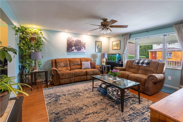 600 Margaret St, Mount Oliver, PA 15210 - living area featuring ceiling fan, wood finished floors, and baseboards