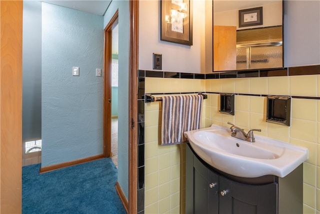 600 Margaret St, Mount Oliver, PA 15210 - bathroom featuring vanity, tile walls, and a textured wall