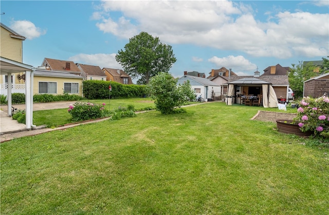 600 Margaret St, Mount Oliver, PA 15210 - view of green lawn featuring a gazebo, a residential view, and a patio