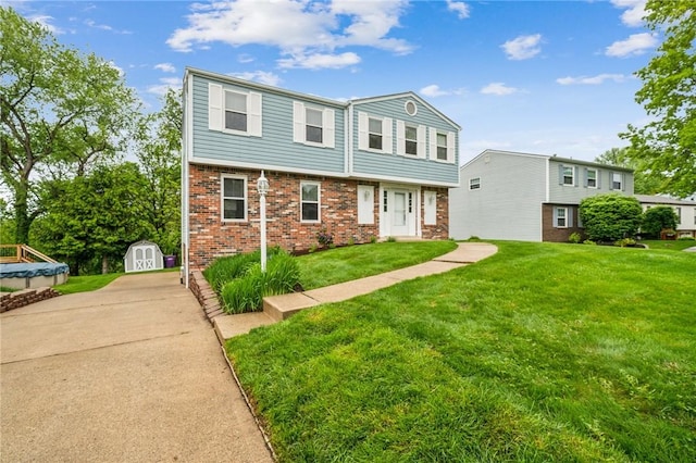 1056 Mcallister Dr, Plum Boro, PA 15068 - view of front facade featuring brick siding, a front lawn, and driveway