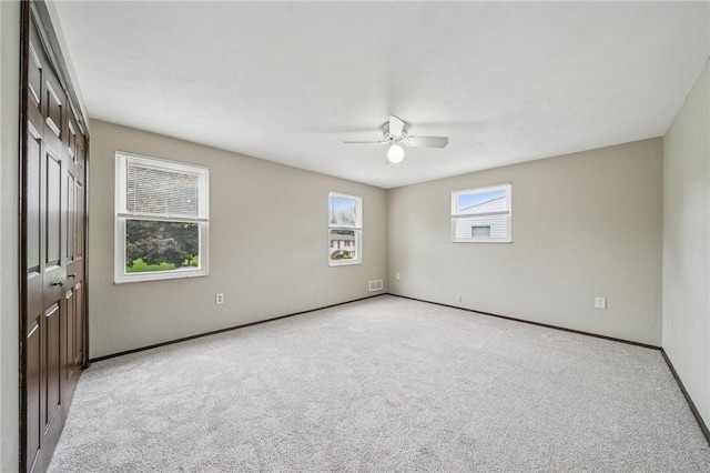 1056 Mcallister Dr, Plum Boro, PA 15068 - unfurnished bedroom with light carpet, baseboards, a closet, and a ceiling fan