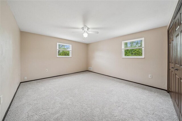 1056 Mcallister Dr, Plum Boro, PA 15068 - unfurnished bedroom with multiple windows, carpet flooring, a closet, and baseboards