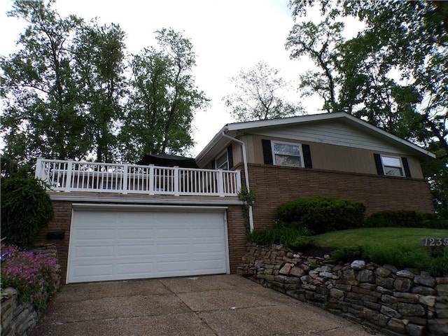 1235 Old Concord Rd, Monroeville, PA 15146 - view of front of home featuring brick siding, concrete driveway, and a garage