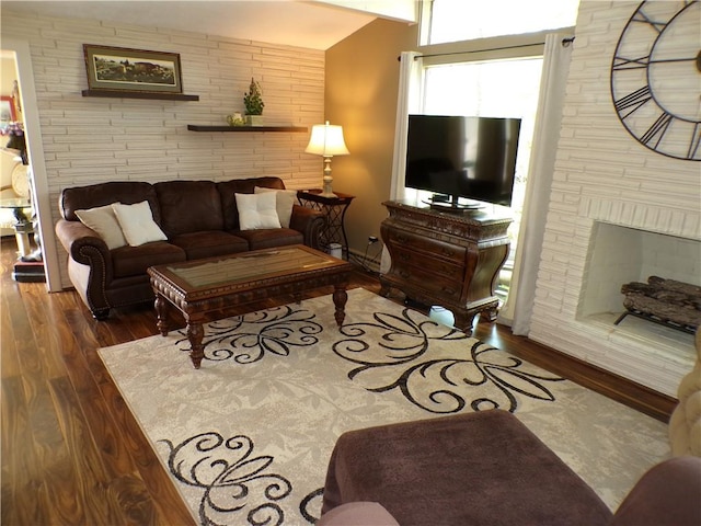 1235 Old Concord Rd, Monroeville, PA 15146 - living room featuring wood finished floors, brick wall, and a fireplace