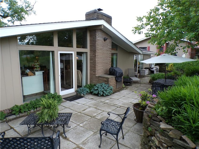 1235 Old Concord Rd, Monroeville, PA 15146 - rear view of house featuring a chimney and a patio area