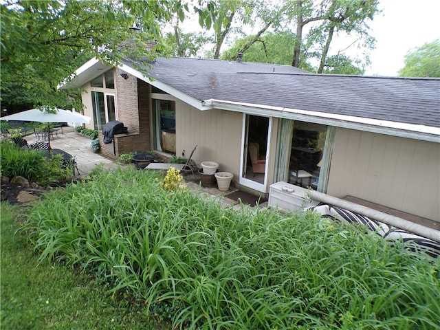 1235 Old Concord Rd, Monroeville, PA 15146 - back of property with roof with shingles, a patio, and a chimney