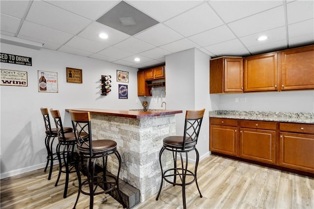 97 Clover Ln, Pine Twp Nal, PA 15044 - indoor wet bar with light wood-style floors, baseboards, a paneled ceiling, and recessed lighting