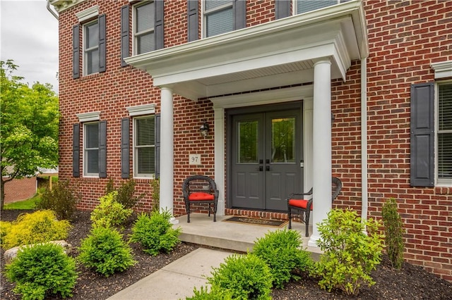97 Clover Ln, Pine Twp Nal, PA 15044 - view of exterior entry featuring brick siding and french doors