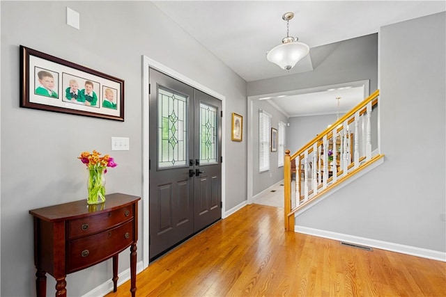 97 Clover Ln, Pine Twp Nal, PA 15044 - entryway with baseboards, light wood-style flooring, and stairs