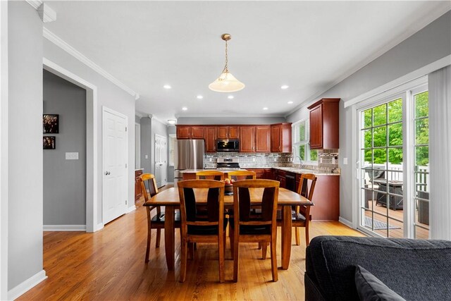 97 Clover Ln, Pine Twp Nal, PA 15044 - dining area with light wood finished floors, crown molding, baseboards, and recessed lighting