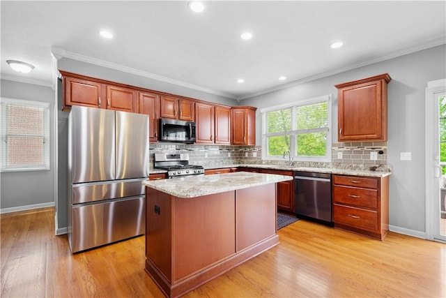97 Clover Ln, Pine Twp Nal, PA 15044 - kitchen with stainless steel appliances, crown molding, light wood-type flooring, a center island, and decorative backsplash