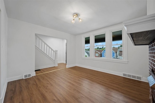 230 Linnview Ave, Carrick, PA 15210 - unfurnished living room featuring stairway, wood finished floors, and baseboards