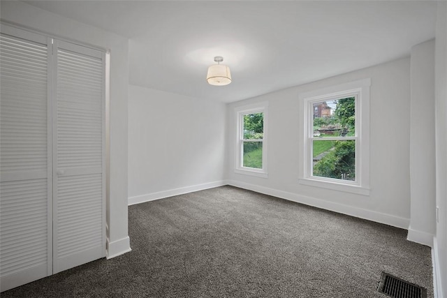 230 Linnview Ave, Carrick, PA 15210 - unfurnished bedroom with dark carpet, baseboards, and a closet