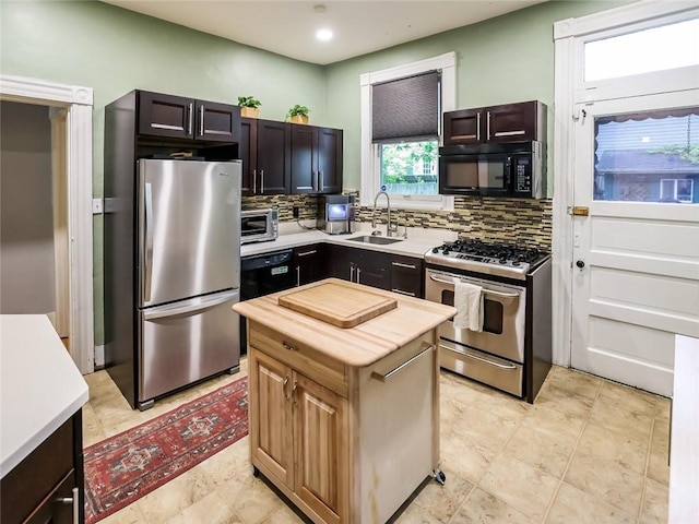 347 Spahr St, Shadyside, PA 15232 - kitchen with black appliances, a sink, tasteful backsplash, a kitchen island, and recessed lighting