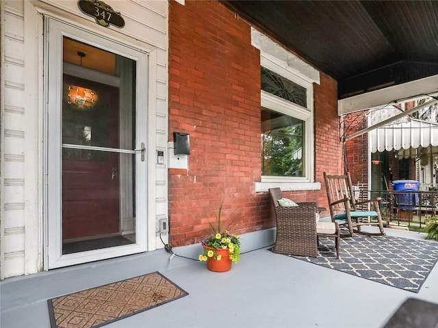 347 Spahr St, Shadyside, PA 15232 - doorway to property featuring a porch and brick siding