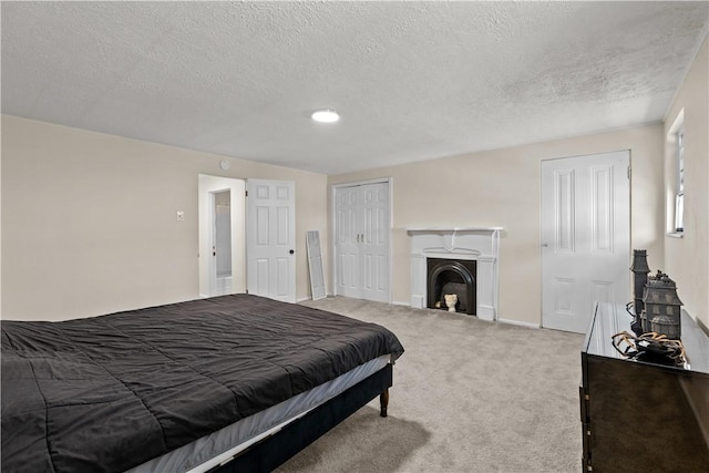 115 Frederick St, Mount Oliver, PA 15210 - bedroom with a textured ceiling, carpet flooring, a fireplace, and baseboards