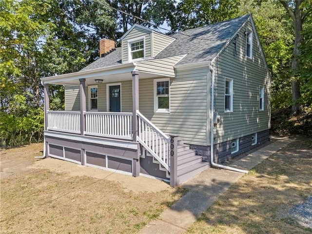 600 Howard St, Harmony Twp Bea, PA 15003 - view of front of property with a chimney, a porch, and roof with shingles