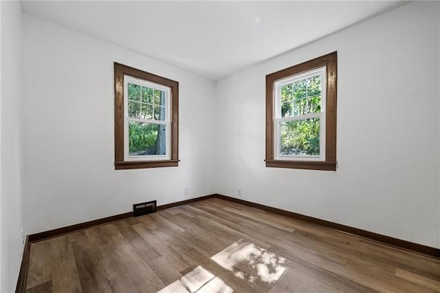 600 Howard St, Harmony Twp Bea, PA 15003 - spare room with healthy amount of natural light, wood finished floors, and baseboards