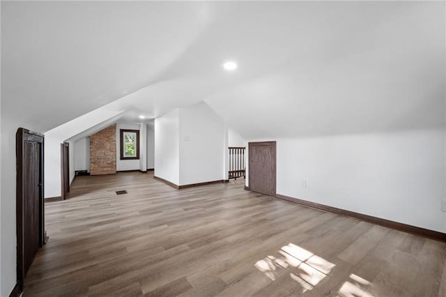 600 Howard St, Harmony Twp Bea, PA 15003 - additional living space with lofted ceiling, baseboards, wood finished floors, and recessed lighting