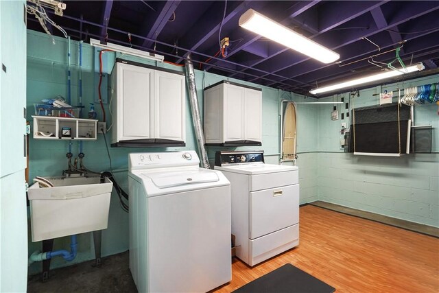 441 Wyndhurst Dr, Moon/Crescent Twp, PA 15108 - laundry area featuring cabinet space, washing machine and dryer, and light wood-style flooring