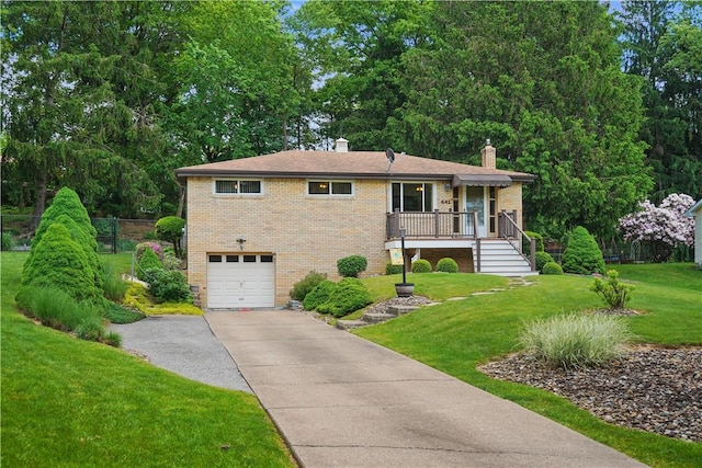 441 Wyndhurst Dr, Moon/Crescent Twp, PA 15108 - view of front of property with a chimney, brick siding, an attached garage, asphalt driveway, and a front lawn