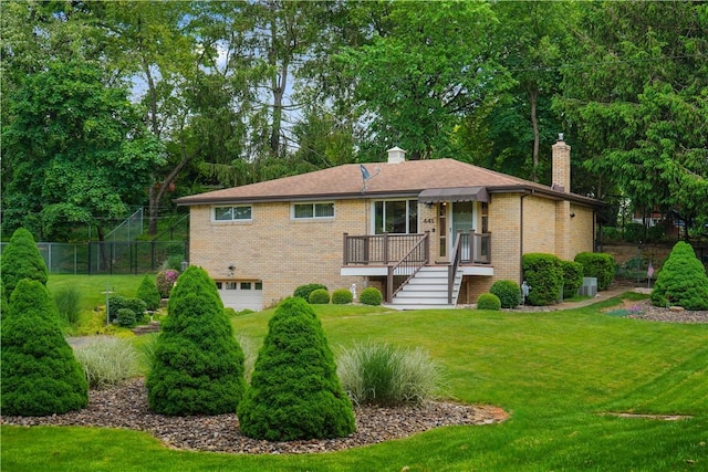 441 Wyndhurst Dr, Moon/Crescent Twp, PA 15108 - back of house featuring a chimney, a garage, brick siding, stairs, and a wooden deck