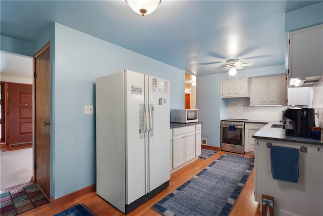 441 Wyndhurst Dr, Moon/Crescent Twp, PA 15108 - kitchen featuring white appliances, ceiling fan, light wood-type flooring, backsplash, and white cabinets
