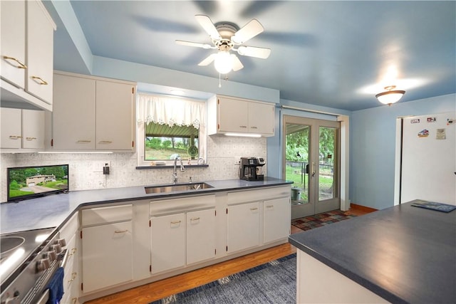 441 Wyndhurst Dr, Moon/Crescent Twp, PA 15108 - kitchen with a sink, decorative backsplash, freestanding refrigerator, dark countertops, and healthy amount of natural light
