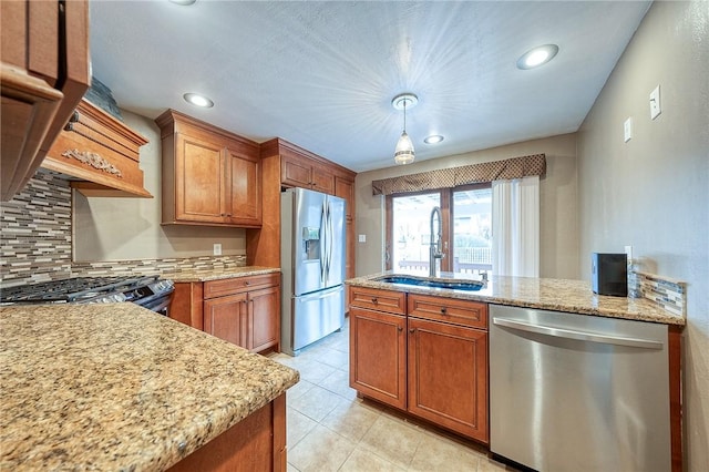 62 Spring St, Etna, PA 15223 - kitchen with stainless steel appliances, a sink, brown cabinetry, backsplash, and recessed lighting