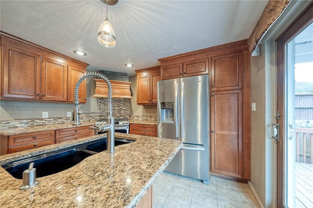 62 Spring St, Etna, PA 15223 - kitchen with stainless steel fridge, brown cabinetry, tasteful backsplash, and recessed lighting