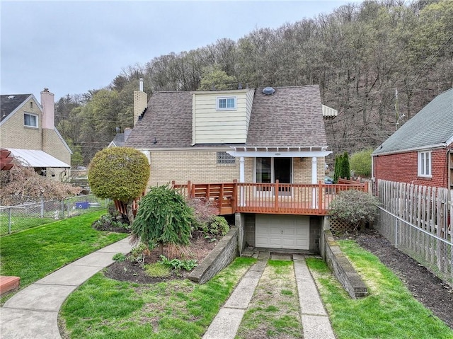 62 Spring St, Etna, PA 15223 - rear view of property with driveway, brick siding, a wooden deck, a shingled roof, and a garage
