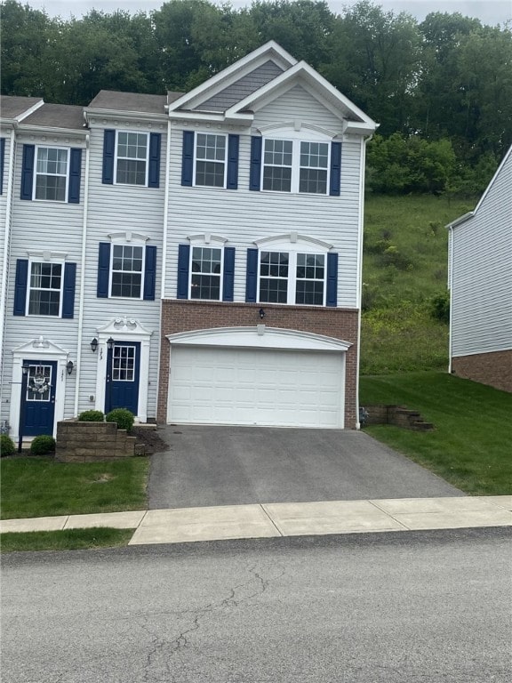 173 Rylie Dr, Lehigh Twp, PA 16037 - view of front of property with driveway, a garage, and brick siding
