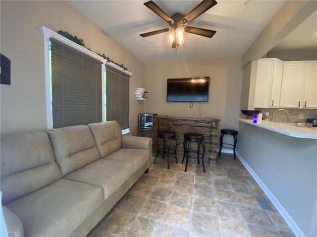173 Rylie Dr, Lehigh Twp, PA 16037 - living area featuring a ceiling fan and light stone finish flooring