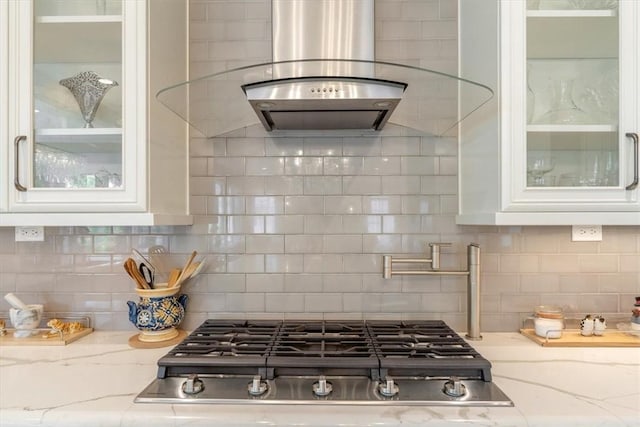 1690 Shelburne Ln, Squirrel Hill, PA 15217 - kitchen featuring stainless steel gas stovetop, white cabinets, glass insert cabinets, and light stone counters