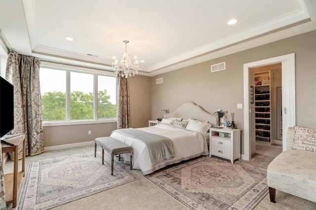 1690 Shelburne Ln, Squirrel Hill, PA 15217 - bedroom with a tray ceiling, light colored carpet, a chandelier, crown molding, and a walk in closet