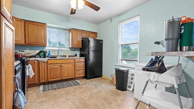 419 Carothers Ave, Carnegie, PA 15106 - kitchen with freestanding refrigerator, ceiling fan, brown cabinetry, and plenty of natural light