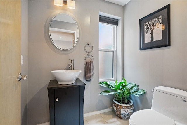 204 Bailey Ave, Mt Washington, PA 15211 - bathroom featuring toilet, vanity, baseboards, and tile patterned flooring
