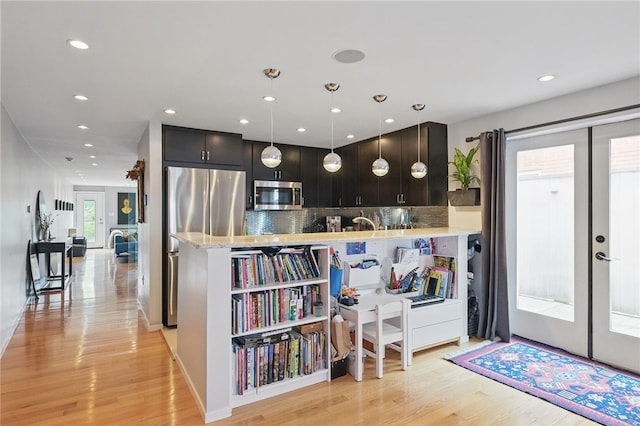 204 Bailey Ave, Mt Washington, PA 15211 - kitchen featuring stainless steel appliances, light wood-style flooring, decorative backsplash, recessed lighting, and french doors