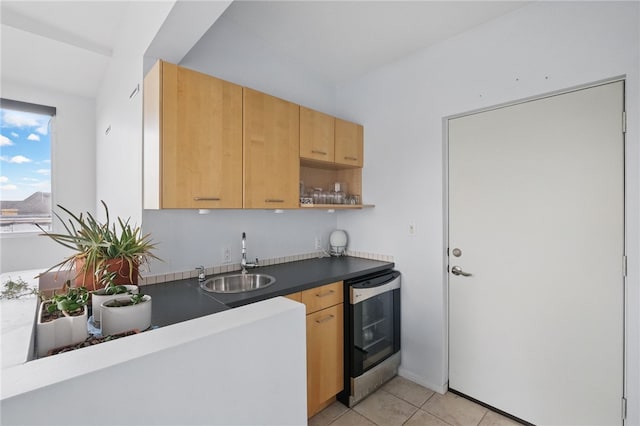 204 Bailey Ave, Mt Washington, PA 15211 - kitchen with beverage cooler, a sink, light tile patterned flooring, dark countertops, and light brown cabinetry
