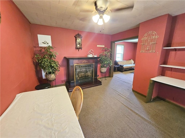 114 Leonard Rd, Washington Twp But, PA 16040 - carpeted dining space with a ceiling fan and a glass covered fireplace