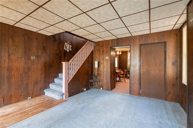 1318 Princess Ave, Beechview, PA 15216 - below grade area with carpet, stairs, wood walls, and a paneled ceiling