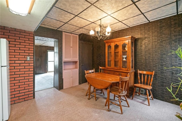 1318 Princess Ave, Beechview, PA 15216 - dining room featuring a paneled ceiling, carpet flooring, and a chandelier